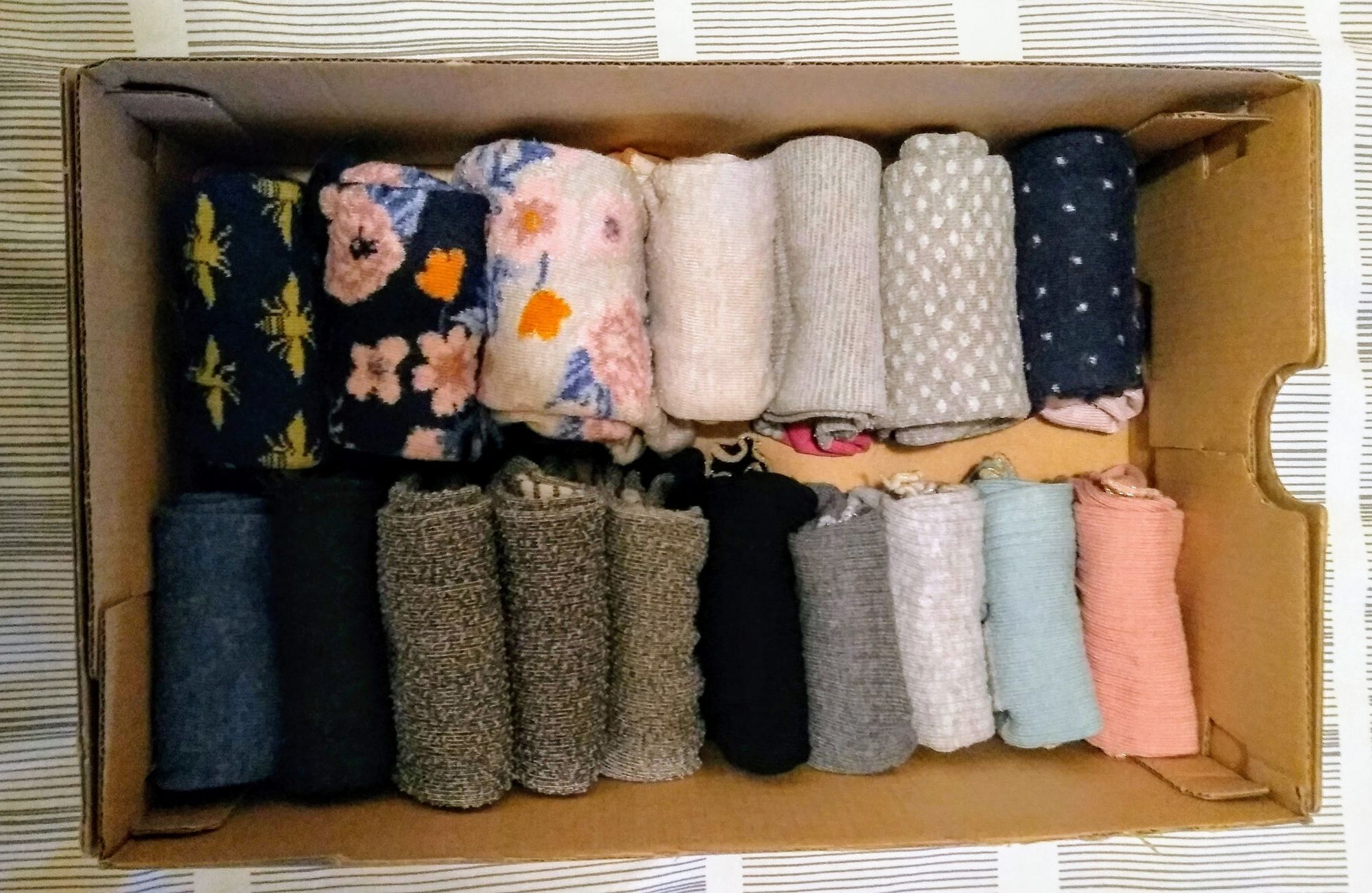 Shoebox full of folded socks